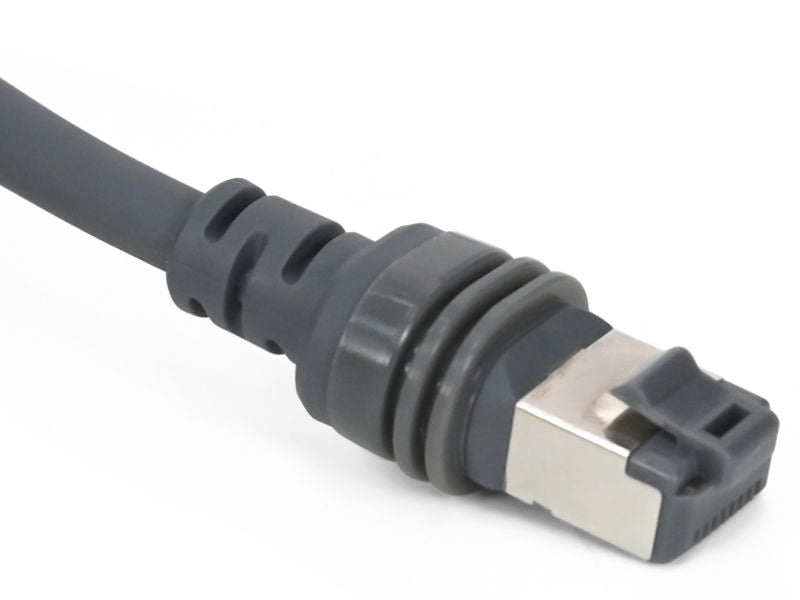 Starlink extension cable sealed plug close up showing rubber strain relief and gold contact pins